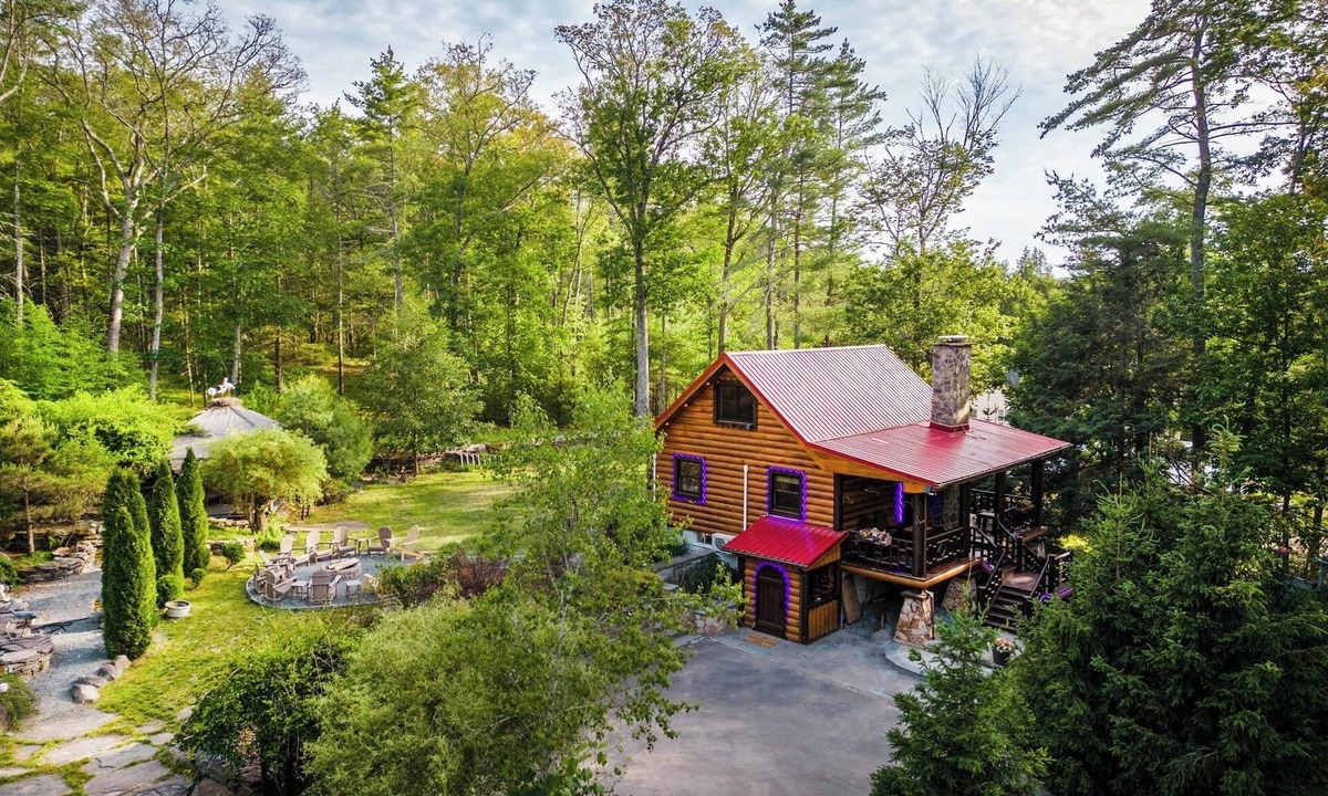 Yulan House | Private log cabin nestled at the base of a secluded wooded area