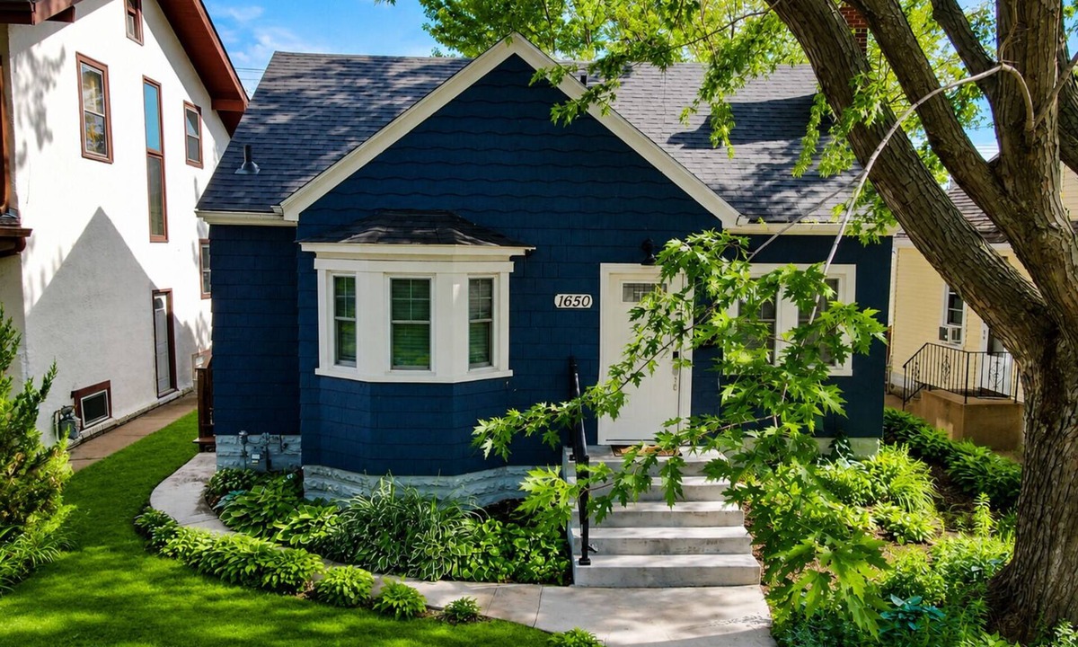 Midway House | The Blue Bungalow: Fully renovated 4BR, 2BA home with cozy Minnesota vibes.