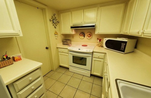 Desert Shores Condo | Lakeside Oasis, Centrally Located w/Huge Deck free wifi & Heated Pool