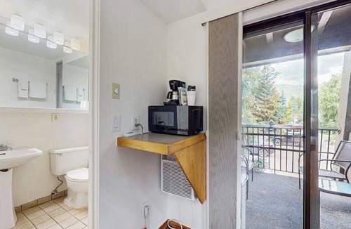 West End Apartment | Private balcony room on Main St - pool & hot tub - walk to lifts, dog-friendly