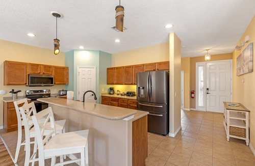Watersong House | Southfacing heated pool and spa home in Watersong close to Disney attractions