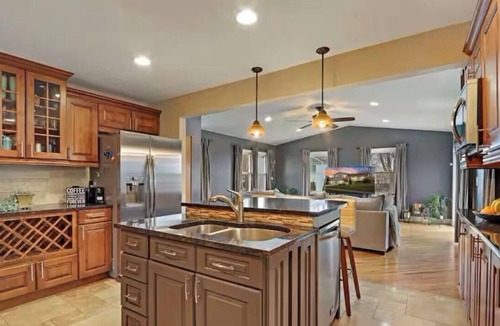 Carol Stream House | Spacious Chicagoland Retreat with Hot Tub + Fireplace Sleeps 8+
