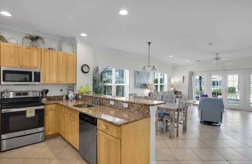 Coral Lagoon Condo | Waterfront Townhome with Boat Slip & Pool Access
