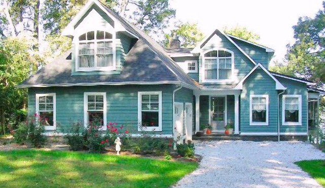 A huge deck and screen porch on this contemporary cape in Edgewater offers great views of Beard's Creek and out onto the South River.