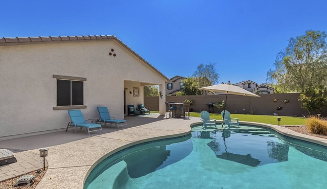Airy desert home with an enclosed yard, private pool, hot tub, firepit, & W/D