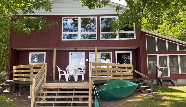 Clean, Rustic 4-bedroom cabin nestled in the woods in Sackets Harbor