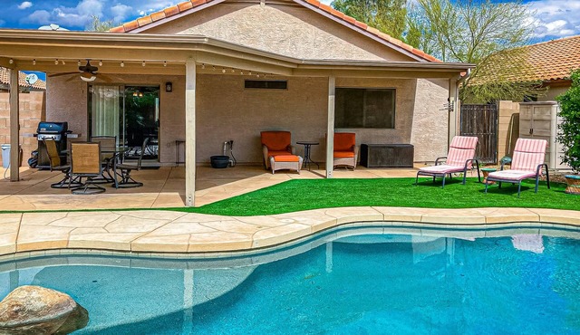 Desert charmer with enclosed yard, heated pool, smart TVs, W/D, & full kitchen