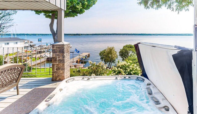Historic riverfront home near downtown with private hot tub, river views, & dock